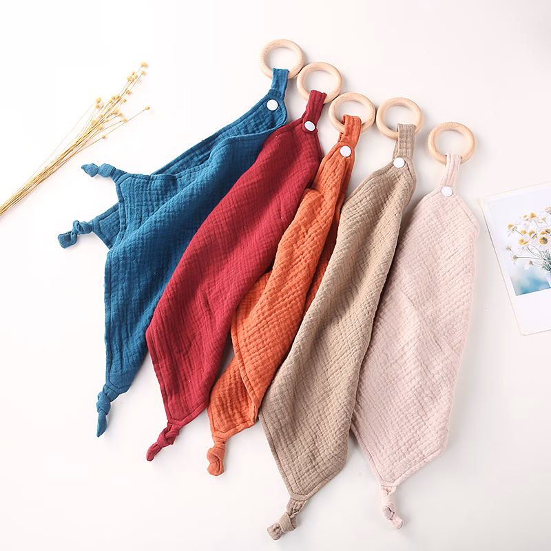Muslin cuddle blanket with a personalised teething ring